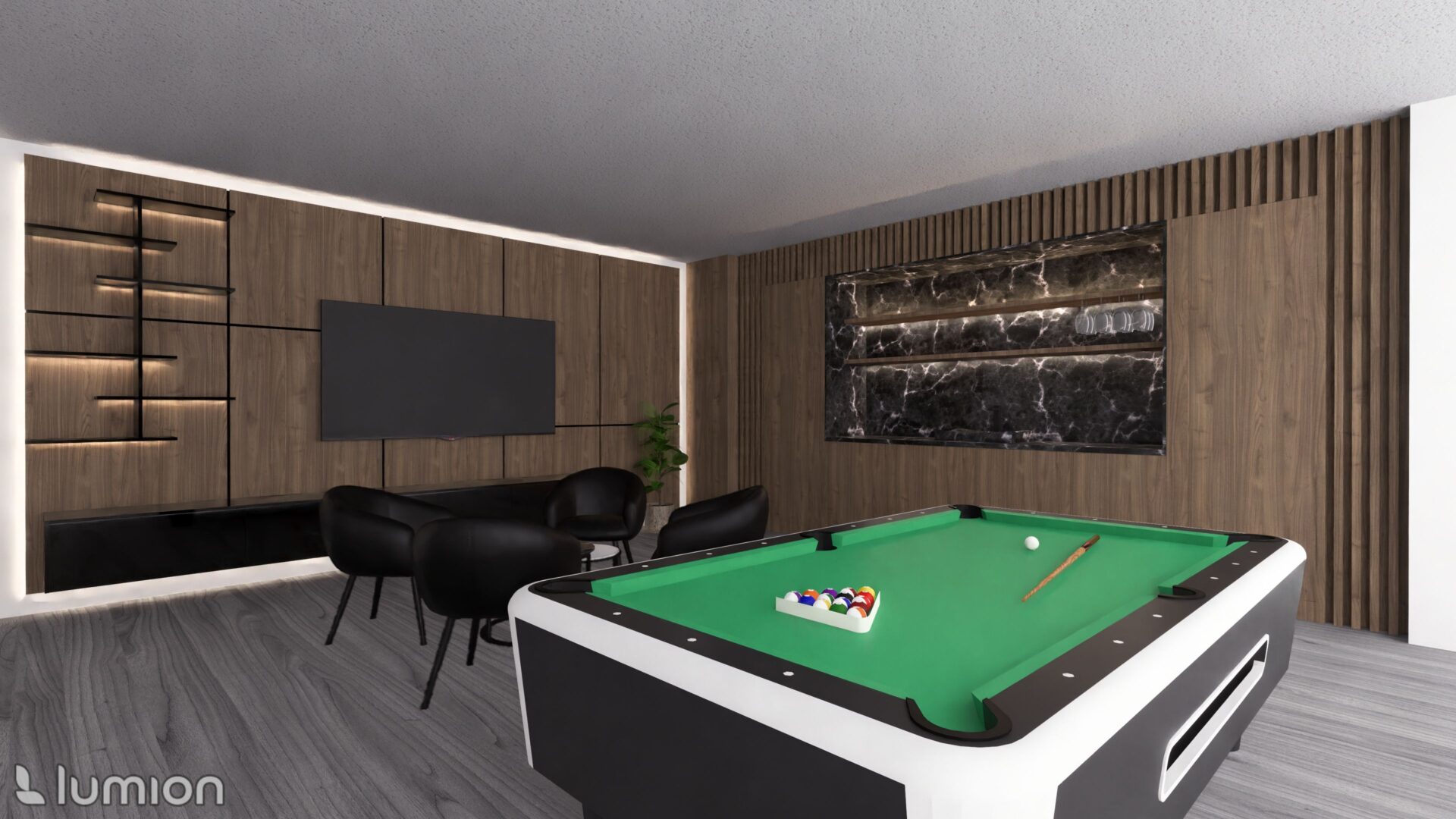 A pool table in the middle of a room with chairs.