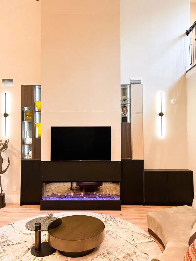 A living room with a television and fireplace